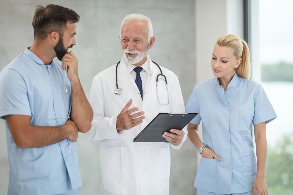 Physicians and clinical staff discussing a plan together